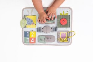 Activitity Buckle Board Urban Garden Taf Toys